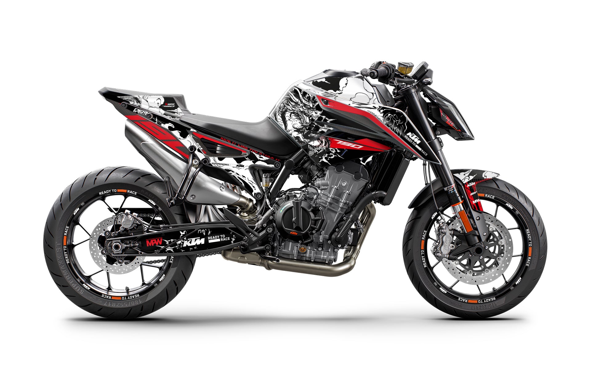 A KTM motorcycle with a red and black graphic kit applied to its body, showcasing the