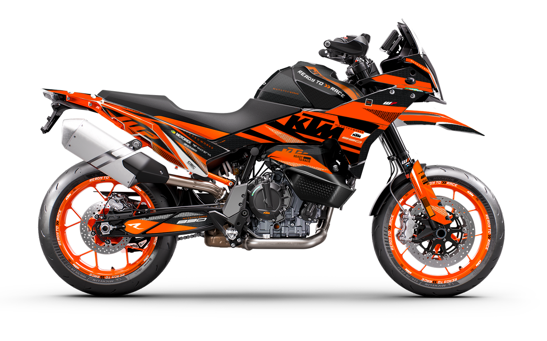 A side profile view of a KTM dual-sport motorcycle in a black and orange livery, set against a plain white studio background.
