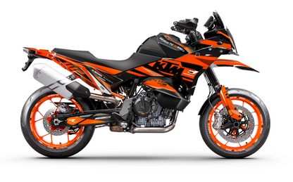 A side profile view of a KTM dual-sport motorcycle in a black and orange livery, set against a plain white studio background.