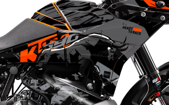 Close-up of a KTM motorcycle with branding and design details.
